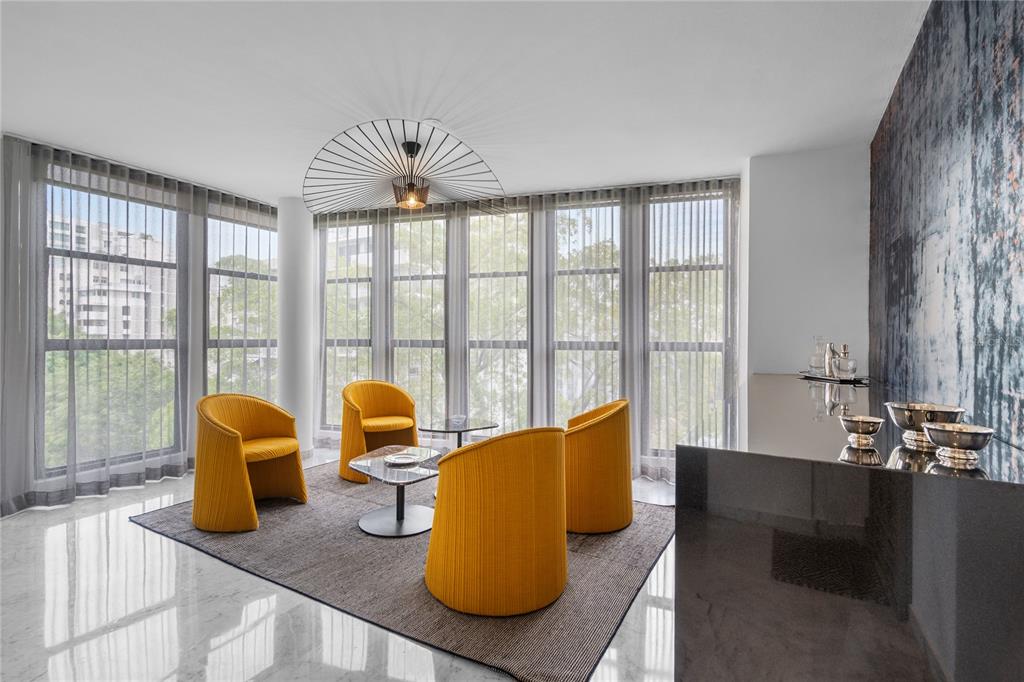 A modern open-concept living and dining area with marble floors, floor-to-ceiling windows, and pendant lighting — 1223 LUCHETTI STREET UNIT 7S, SAN JUAN, PR