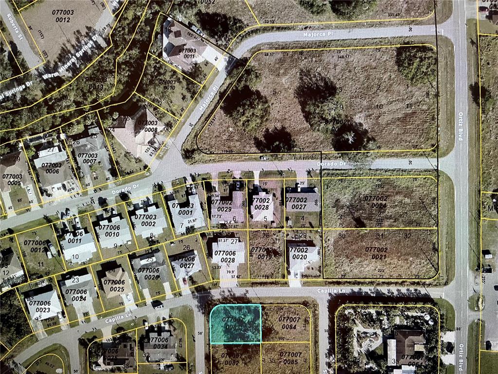 This is an aerial map showing residential lots and streets in a suburban neighborhood — Lot #1 CAPILLA LANE, NORTH PORT, FL