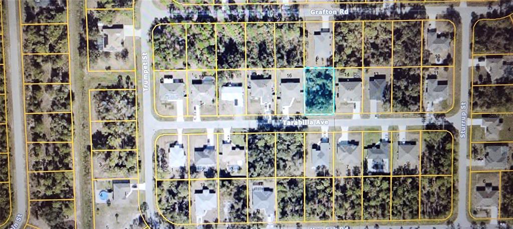 This is an aerial map showing a vacant lot highlighted in blue within a residential neighborhood — TARABILLA AVENUE, NORTH PORT, FL