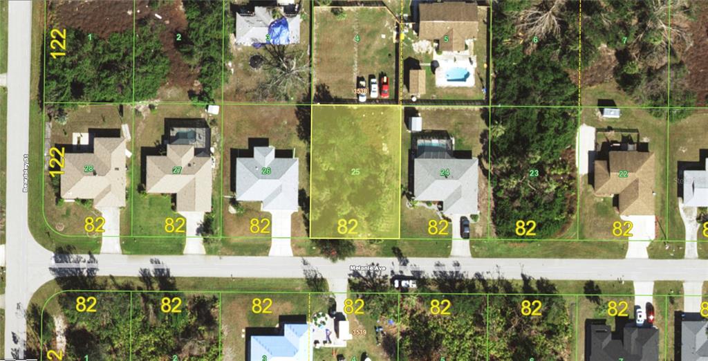 This is an aerial map showing a vacant residential lot highlighted in yellow among surrounding houses — 10068 MELANIE AVENUE, ENGLEWOOD, FL