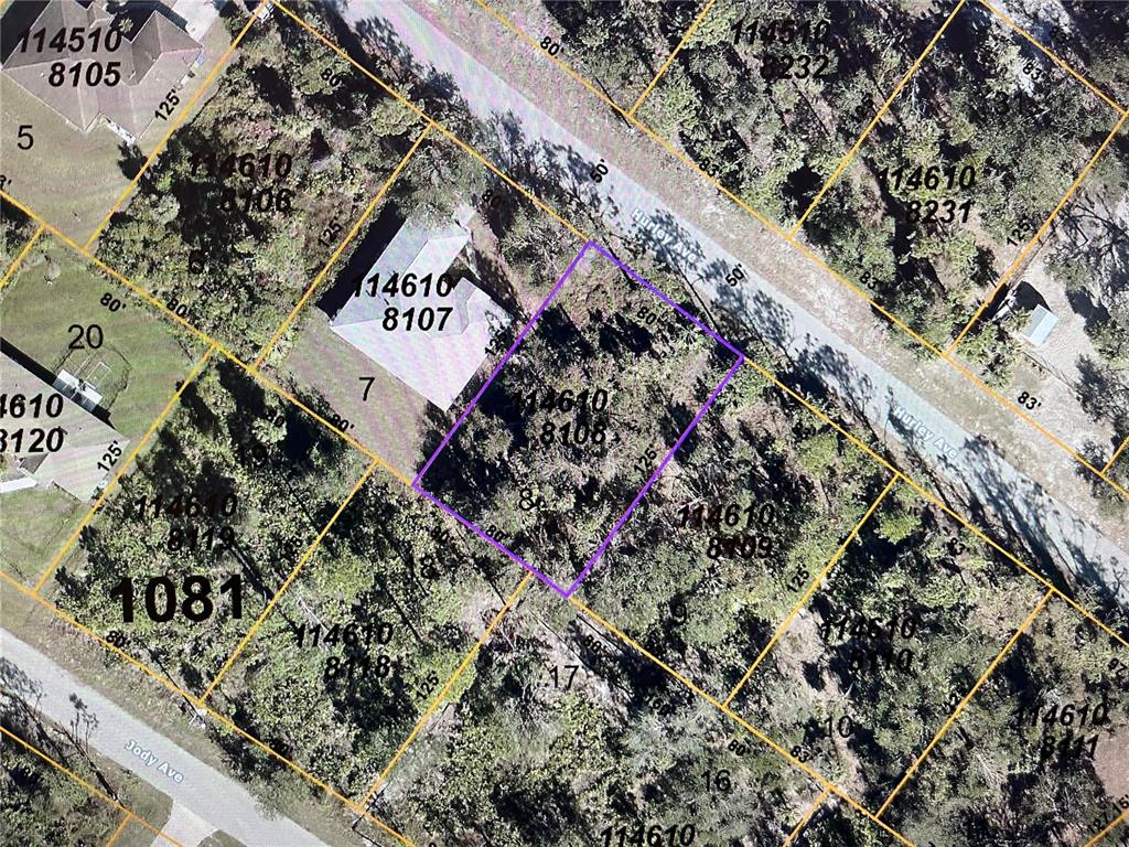 This is an aerial map showing a vacant lot highlighted in purple among residential properties — LOT 8,9,10 HURLEY AVENUE, NORTH PORT, FL
