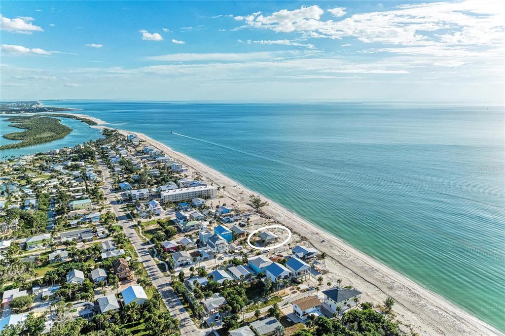 An aerial view shows a coastal neighborhood with a house circled near the beach — 45 WILHELM DRIVE, ENGLEWOOD, FL