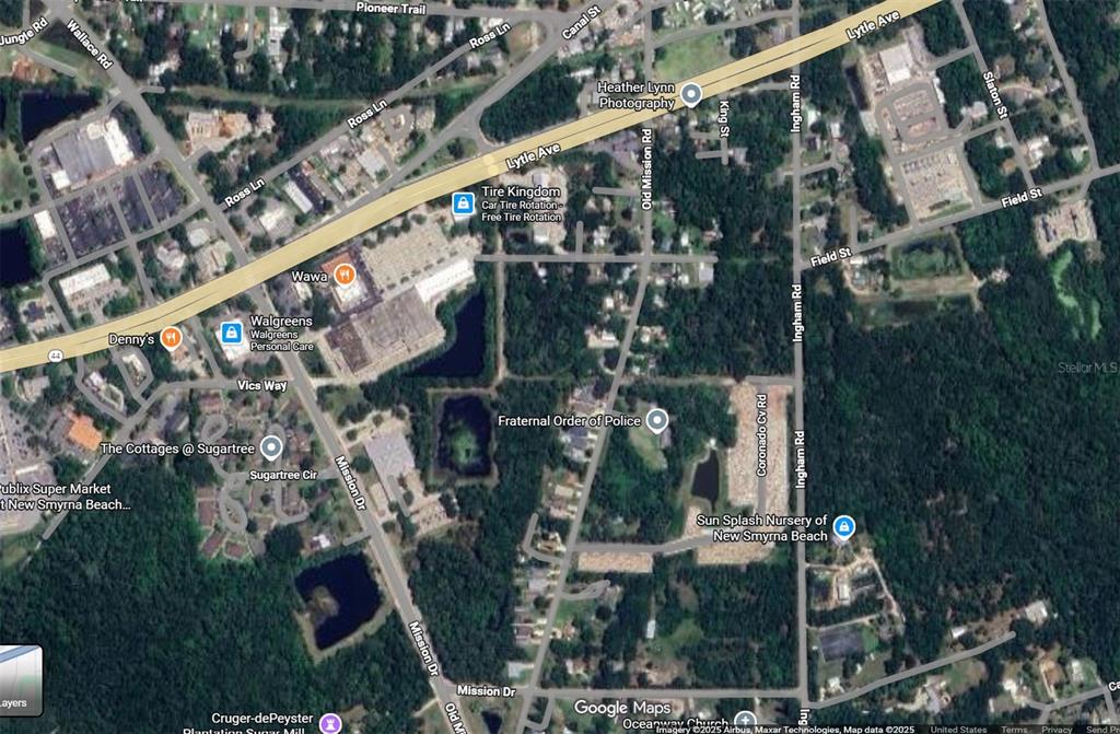 This is a satellite map view of a commercial and residential area in New Smyrna Beach — SAINT JAMES WAY, NEW SMYRNA BEACH, FL