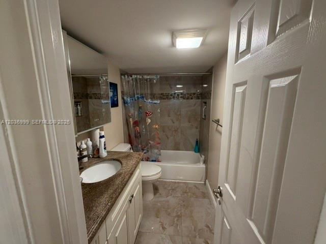 A bathroom features a vanity with a granite countertop, a toilet, and a tiled tub-shower — 101 SE 3rd Ave # 506, Dania Beach FL 33004, DANIA BEACH, FL