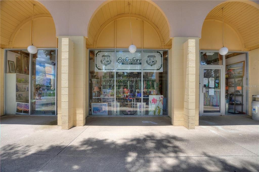The exterior of a retail storefront features three arched bays with glass windows and doors — 500 CLUB CIRCLE UNIT M, LAKESHORE, FL