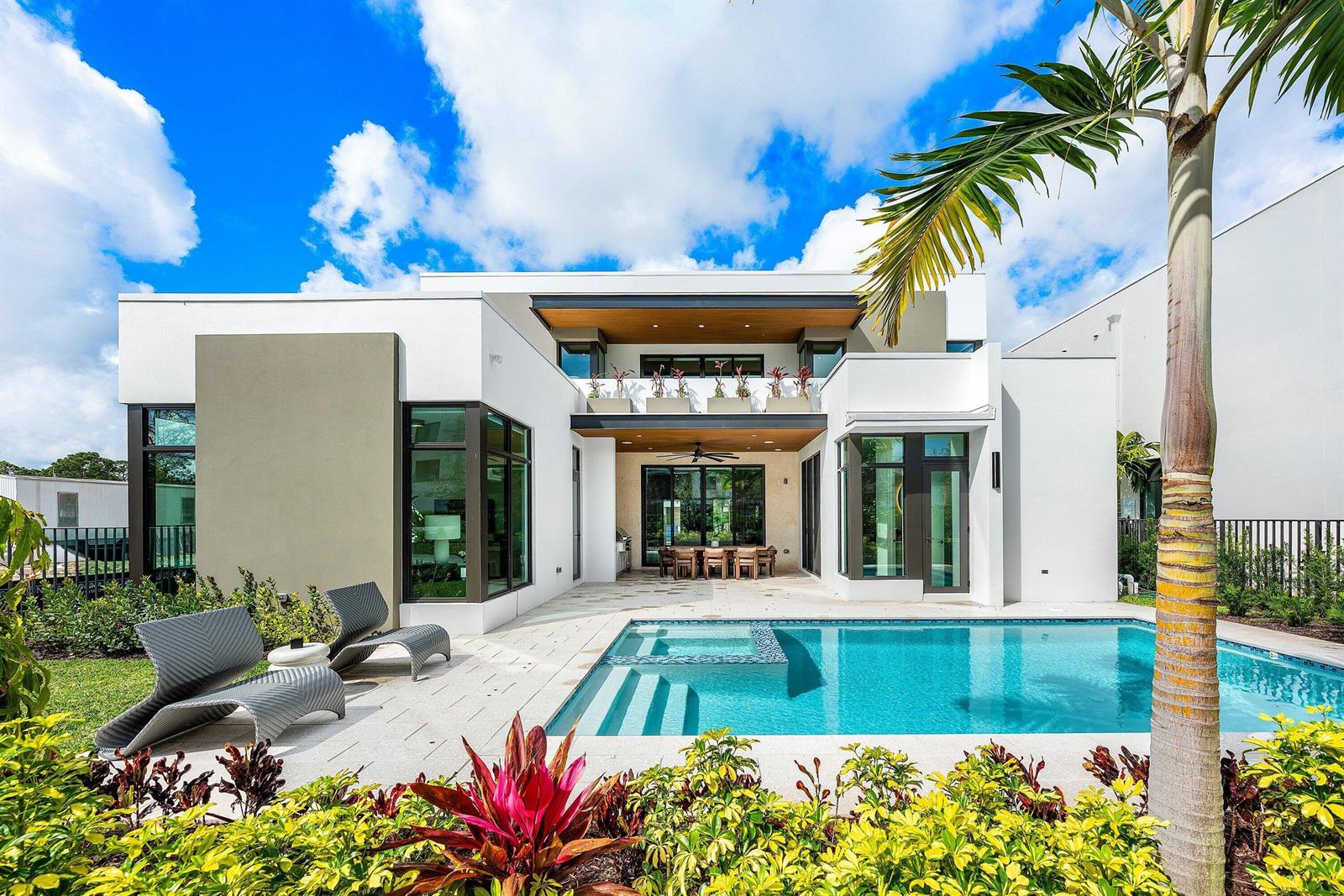 A modern two-story house exterior features a swimming pool, patio, and landscaped garden — 16725 Mosaic Place, Delray Beach FL 33446, DELRAY BEACH, FL
