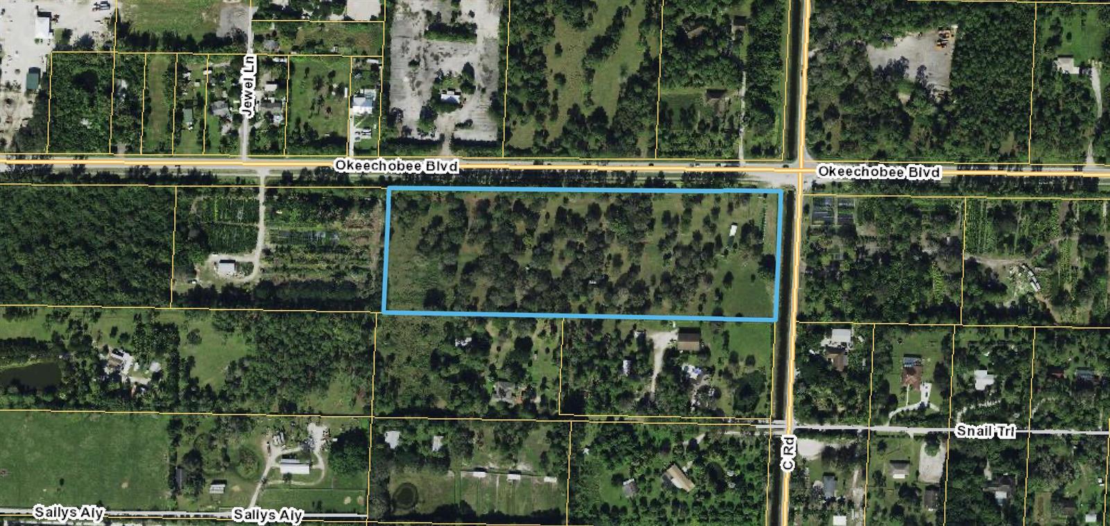 This aerial map shows a rectangular plot of land outlined in blue near a road — Xxxx Okeechobee Boulevard, FL, FL