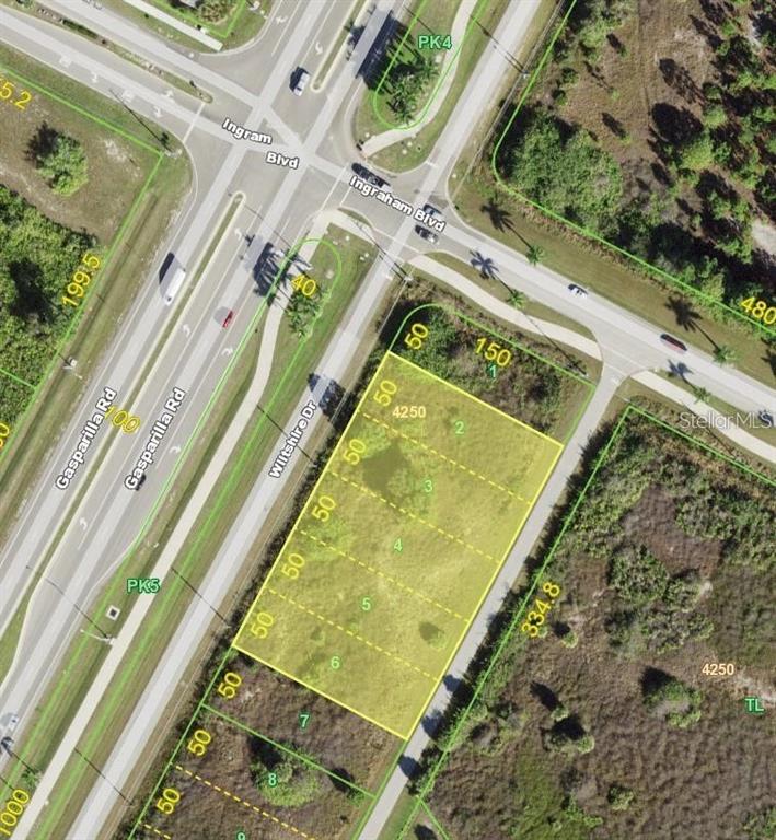 This is an aerial map showing a vacant rectangular land parcel divided into multiple lots — 8420 WILTSHIRE DRIVE, PORT CHARLOTTE, FL