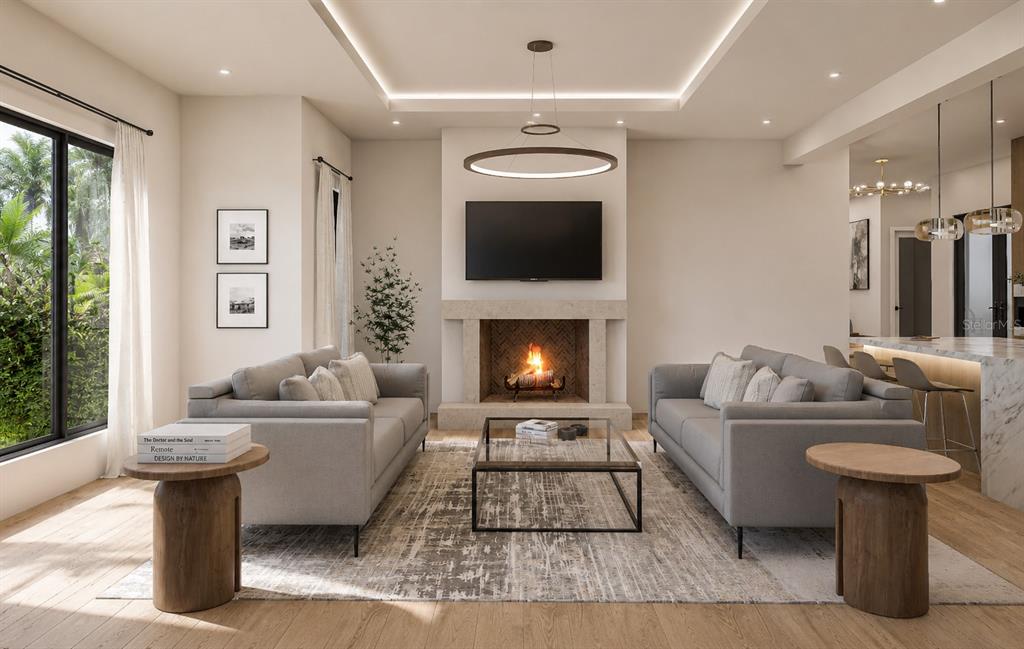 This is a rendering of a modern living room featuring a fireplace and two sofas — 3406 BAYSHORE BLVD NE, ST PETERSBURG, FL