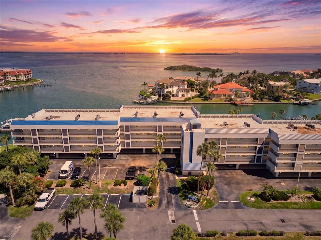 A balcony view overlooking a marina with several boats docked in the water — 363 PINELLAS BAYWAY S UNIT 29, TIERRA VERDE, FL
