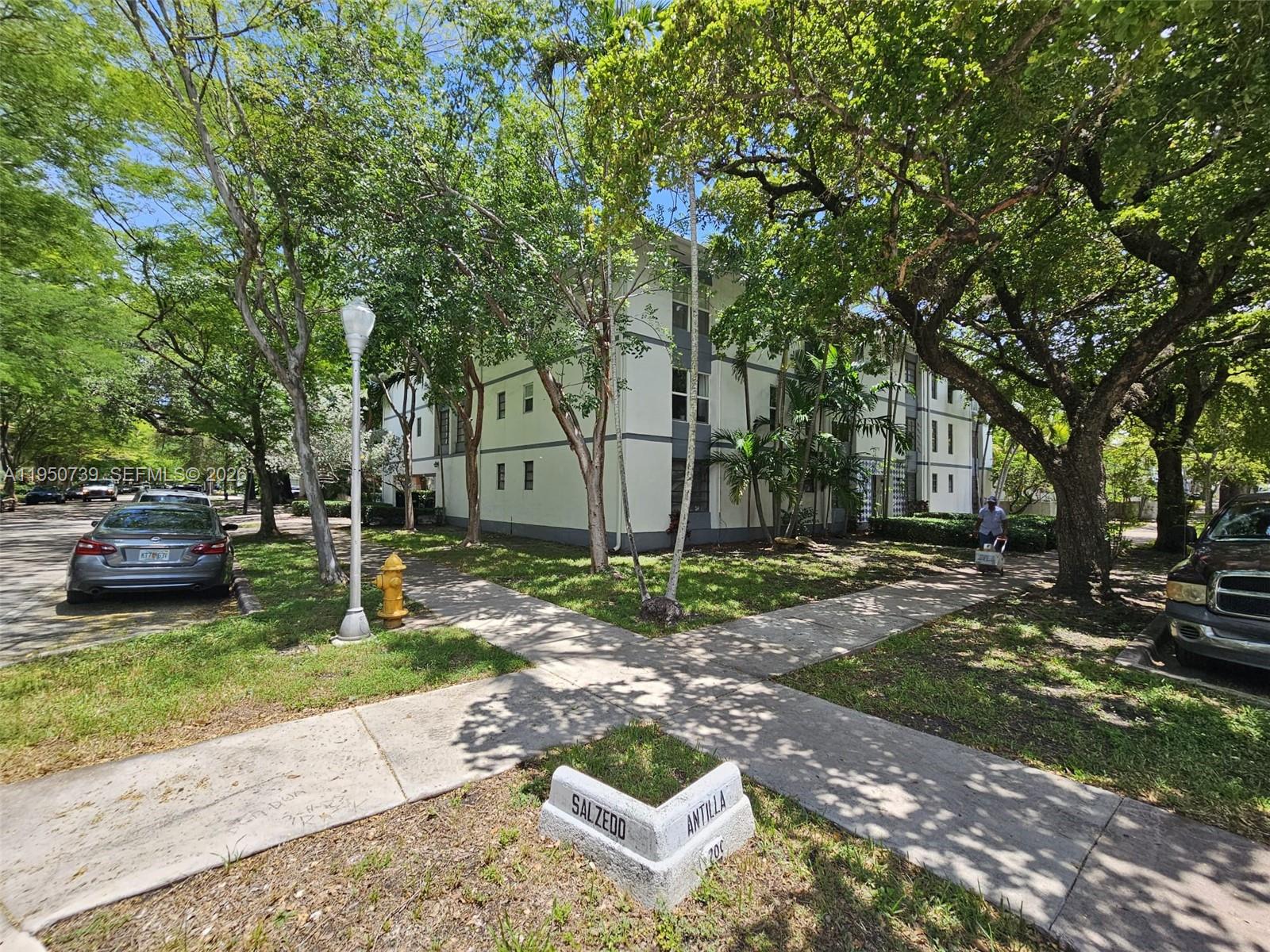 A three-story apartment building stands at the corner of Salzedo and Antilla streets — 235 Antilla Ave # 4, Coral Gables FL 33134, CORAL GABLES, FL
