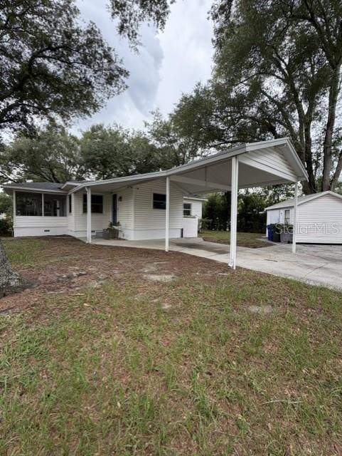 A kitchen features white cabinets, stainless steel appliances, and a patterned tile floor — 540 FRANCIS BOULEVARD, LAKELAND, FL