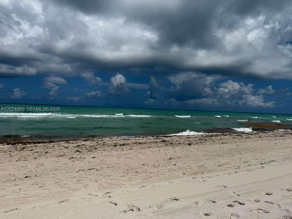 A sandy beach meets the ocean under a cloudy sky — 5313 Collins Ave # 1109, Miami Beach FL 33140, MIAMI BEACH, FL