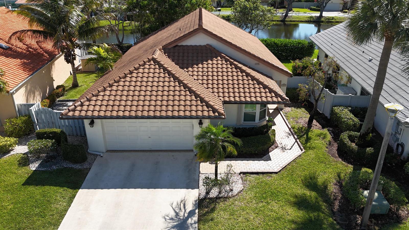 An aerial view of a single-story house with a brown tile roof and garage — 186 Citrus Trail Circle, Boynton Beach FL 33436, BOYNTON BEACH, FL