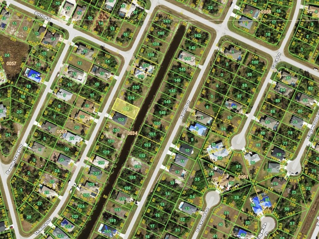 This is an aerial map showing residential lots, streets, and property boundaries in a neighborhood — 129 THELMA DRIVE, ROTONDA WEST, FL