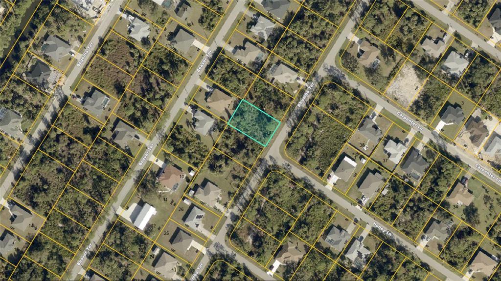 This is an aerial map showing a vacant, rectangular lot highlighted in blue among houses — RHUMBA TERRACE Lot 30, NORTH PORT, FL