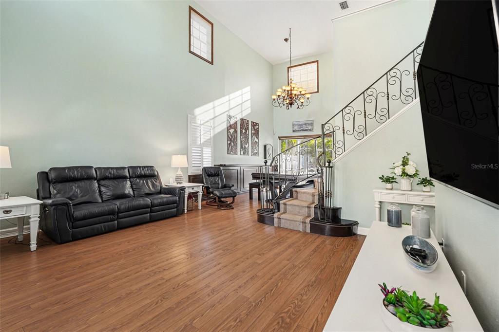 A two-story stucco house with a two-car garage, a brick driveway, and a mailbox — 10618 HATTERAS DRIVE, TAMPA, FL