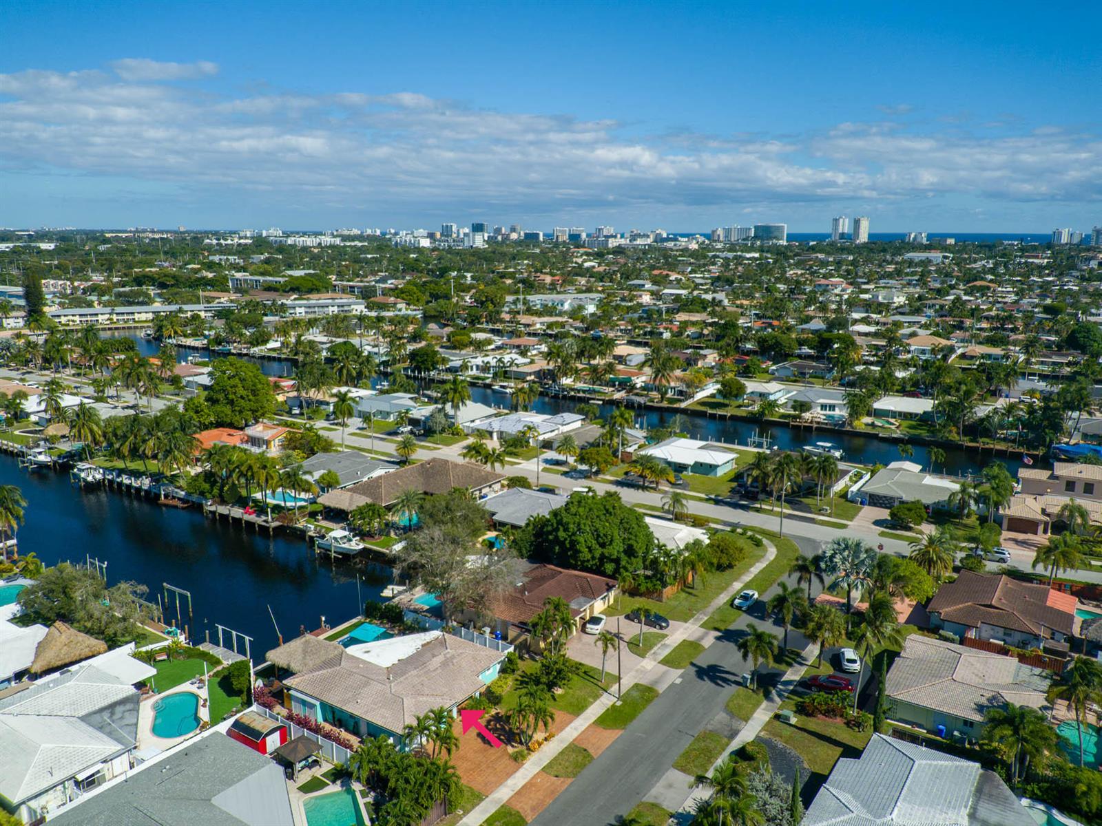 An aerial view of a residential neighborhood with a canal and a highlighted single-family home — 521 SE 4 Court, Pompano Beach FL 33060, POMPANO BEACH, FL