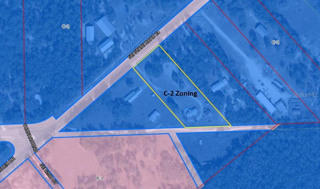 This is an aerial map showing a parcel of land with C-2 zoning — 9230 NE STATE ROAD 24, BRONSON, FL