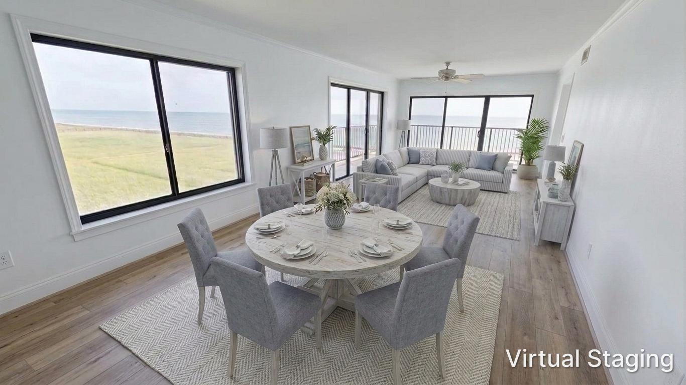 This virtually staged living and dining area features light wood floors and expansive ocean views — 10310 S Ocean Drive # 301, Jensen Beach FL 34957, JENSEN BEACH, FL