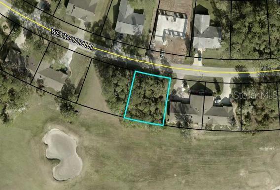 An aerial map view shows a vacant, wooded residential lot outlined in blue on Weymouth Lane — 33 WEYMOUTH LANE, PALM COAST, FL
