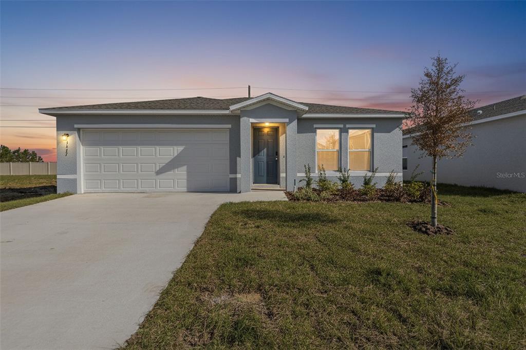 This image is a text list of exterior and interior features for a residential property — 3477 DAHLIA DRIVE, LAKE HAMILTON, FL