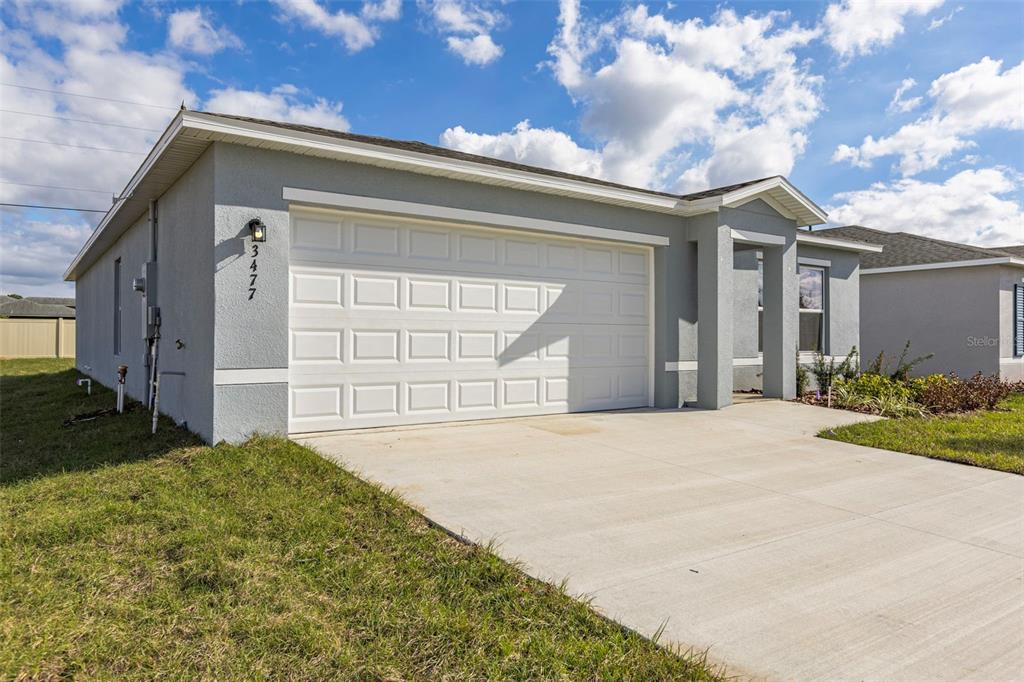 This is a floor plan for a single-story house with four bedrooms and a garage — 3477 DAHLIA DRIVE, LAKE HAMILTON, FL