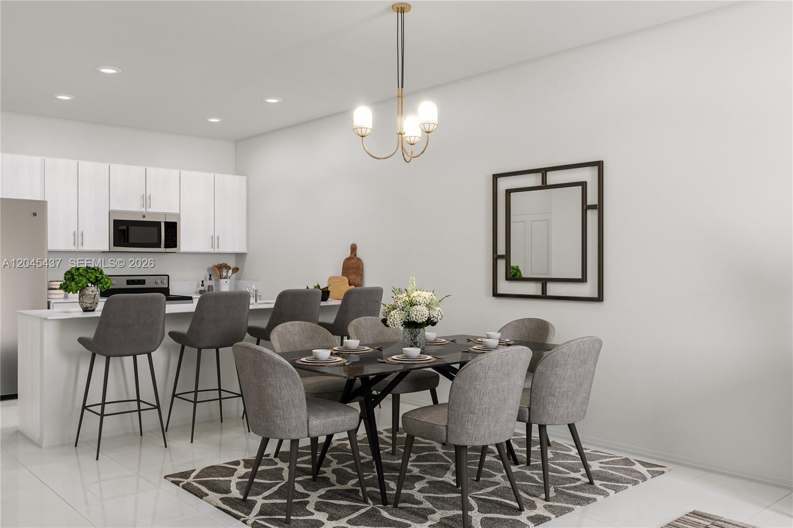A modern dining area features a dark table, gray chairs, and a kitchen island — MIAMI, FL