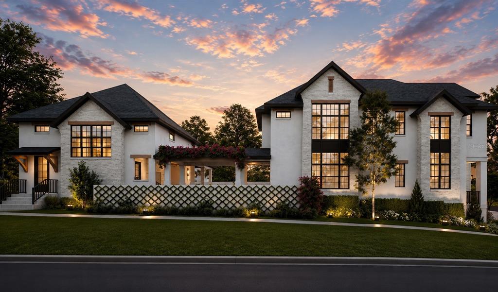 A rendering of a two-story white brick house with black-framed windows at sunset — 2313 N RIVERSIDE DRIVE, TAMPA, FL