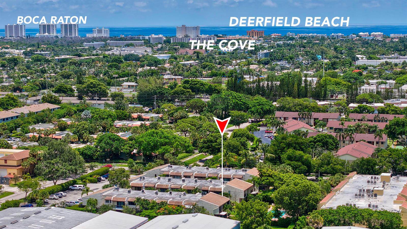 An aerial view shows a residential complex with flat-roofed buildings surrounded by lush green trees — 721 SE 1st Way # C11, Deerfield Beach FL 33441, DEERFIELD BEACH, FL