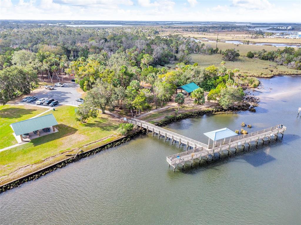 An aerial view shows a park with a parking lot, two pavilions, and a long pier — 11961 W EDGEVIEW COURT UNIT 11961, CRYSTAL RIVER, FL