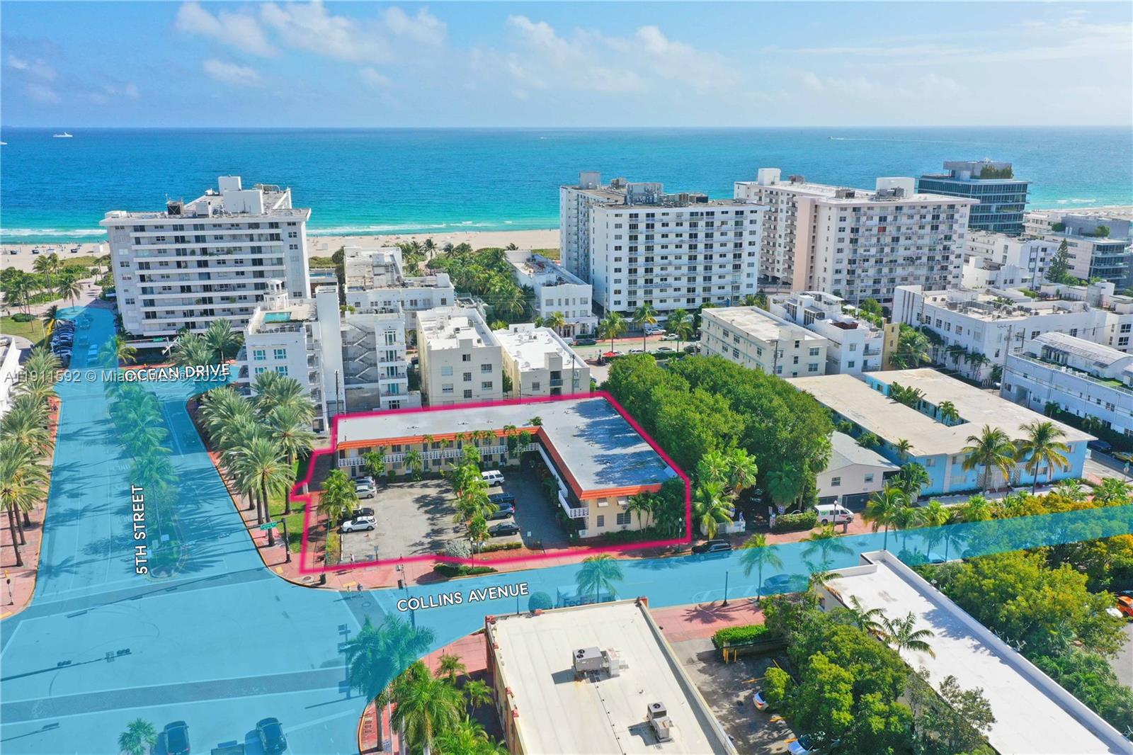 An aerial view shows a low-rise apartment building with a parking lot in Miami Beach — 441 Collins Ave, Miami Beach FL 33139, MIAMI BEACH, FL