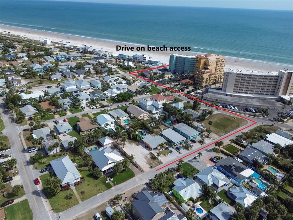 An aerial view shows a coastal neighborhood with a red outline highlighting a property lot — 306 NORMANDY AVENUE, NEW SMYRNA BEACH, FL