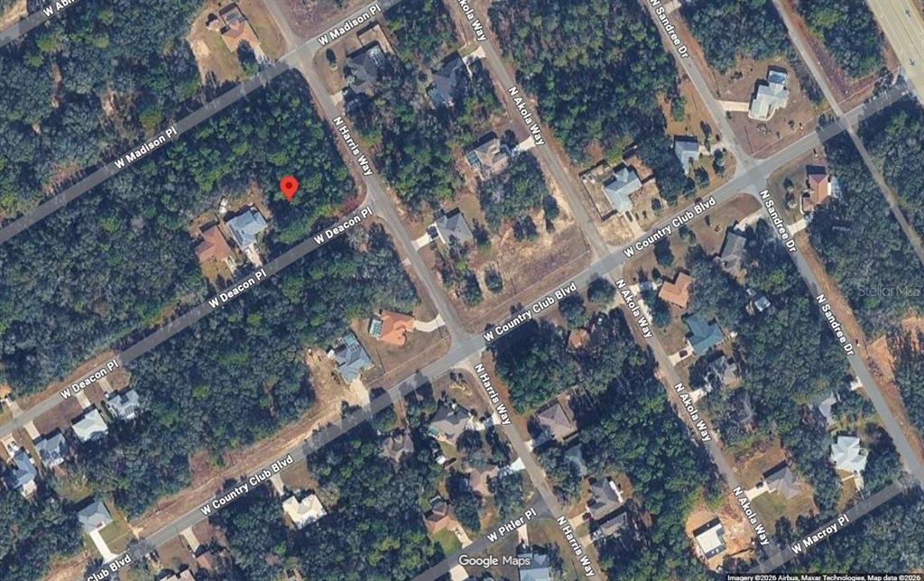 This is an aerial map view of a wooded residential lot marked with a red pin — 731 W DEACON PLACE, CITRUS SPRINGS, FL