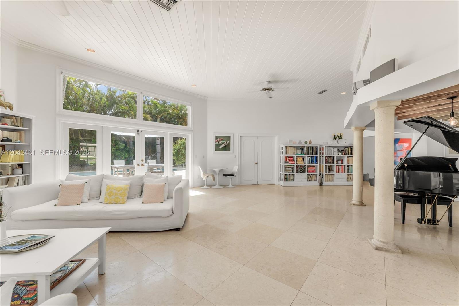 A spacious living room features a vaulted ceiling, white tile floors, and a grand piano — 7924 SW 50th Ct, Miami FL 33143, MIAMI, FL