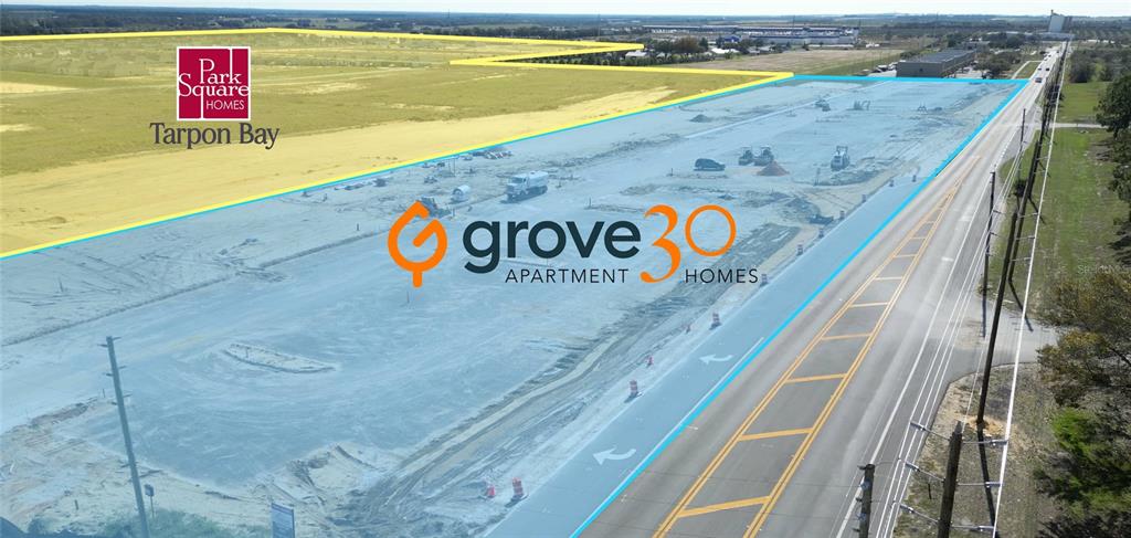 An aerial view shows a construction site outlined in blue next to a paved road — 1295 S 30TH STREET, HAINES CITY, FL
