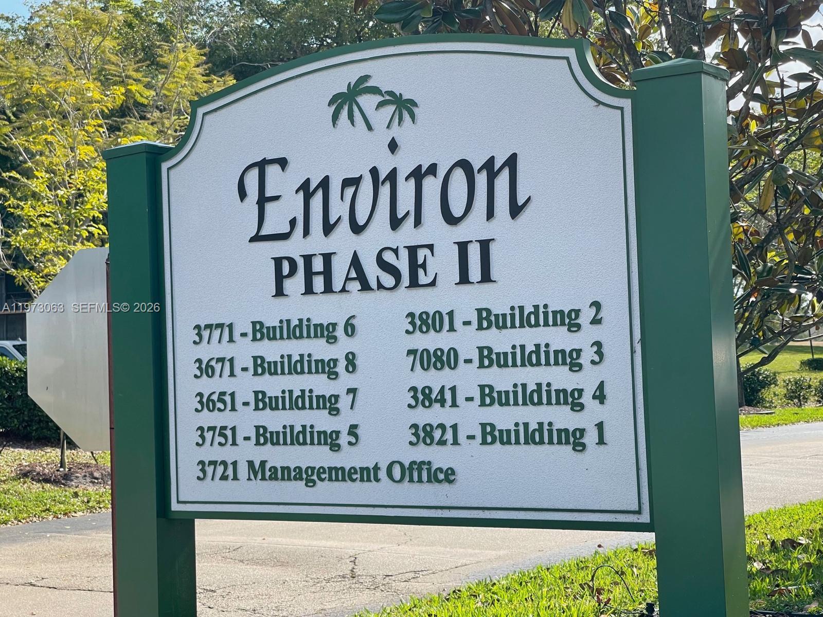 A sign for Environ Phase II lists building numbers and the management office location — 3821 Environ Blvd # 202, Lauderhill FL 33319, LAUDERHILL, FL