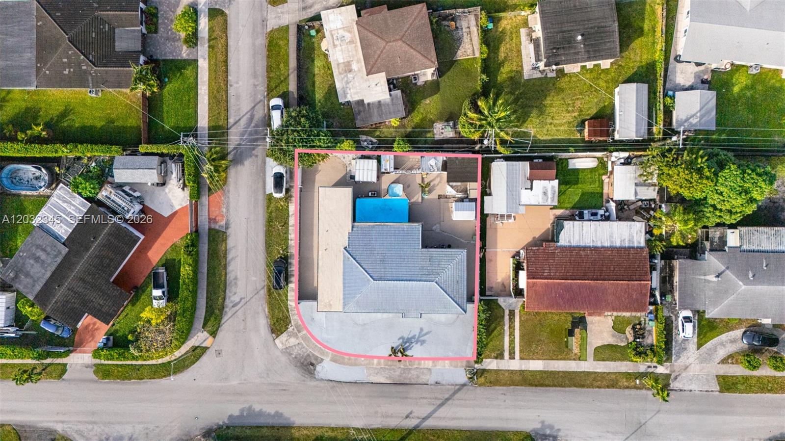 An aerial view shows a residential property with a swimming pool and a large driveway — 9365 SW 44th St, Miami FL 33165, MIAMI, FL