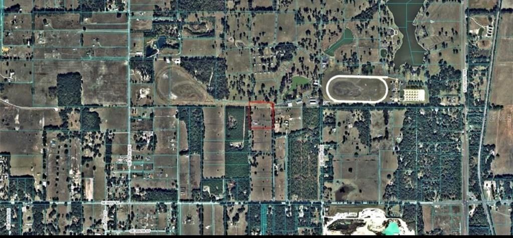 This is an aerial map view showing a property outlined in red within a rural area — 16070 SE 55 AVE RD, SUMMERFIELD, FL