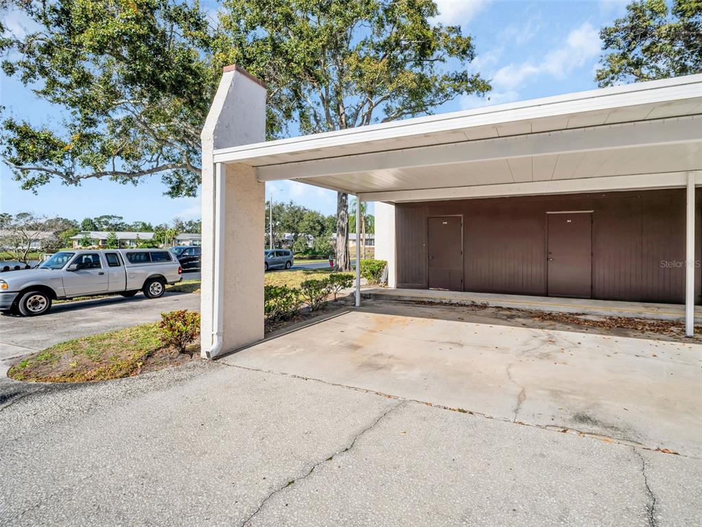 A living and dining area with light-colored walls, tile flooring, and neutral-toned furniture — 3109 MISSION GROVE DRIVE UNIT D, PALM HARBOR, FL