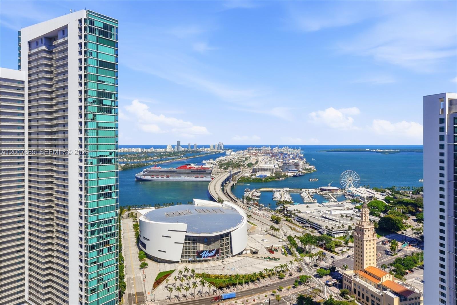 An aerial view shows a high-rise building, the Kaseya Center, a cruise ship, and a bridge — 851 NE 1st Ave # 3711, Miami FL 33132, MIAMI, FL