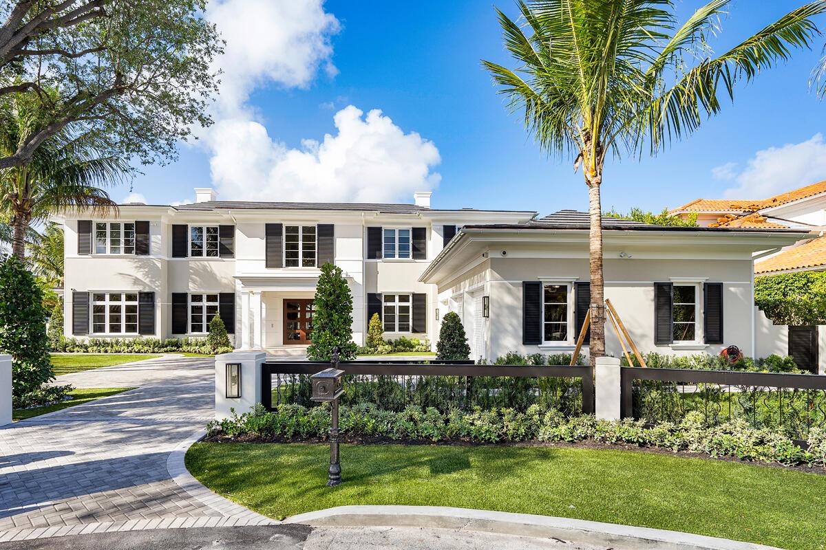 A two-story white house with black shutters, a paved driveway, and a palm tree — 133 W Coconut Palm Road, Boca Raton FL 33432, BOCA RATON, FL