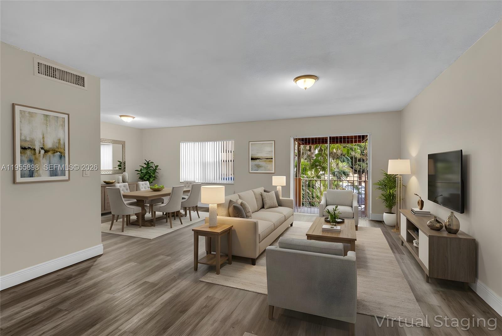 This is a virtually staged living and dining area with light wood-look flooring — 17901 NW 68th Ave # T206, Hialeah FL 33015, HIALEAH, FL