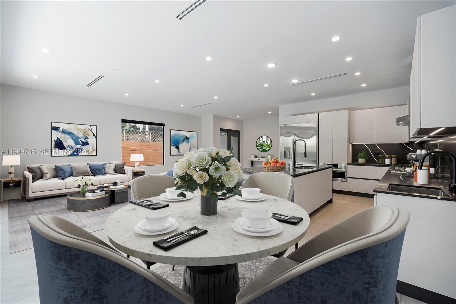 A modern open-concept living and dining area features a marble table, kitchen island, and sofa — 2960 W Trade Av, Coconut Grove FL 33133, COCONUT GROVE, FL
