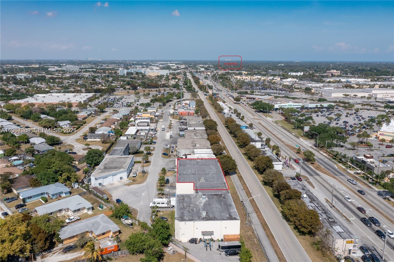 An aerial view shows a commercial building outlined in red next to a major highway — 11441 SW 208th Dr, Miami FL 33189, MIAMI, FL