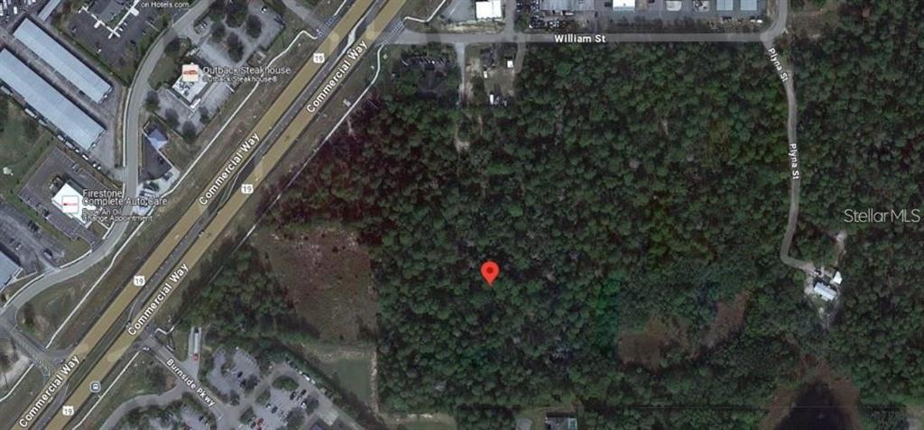 This is an aerial map view of a wooded lot located near a commercial highway — Lot 3 GERBERT STREET, SPRING HILL, FL