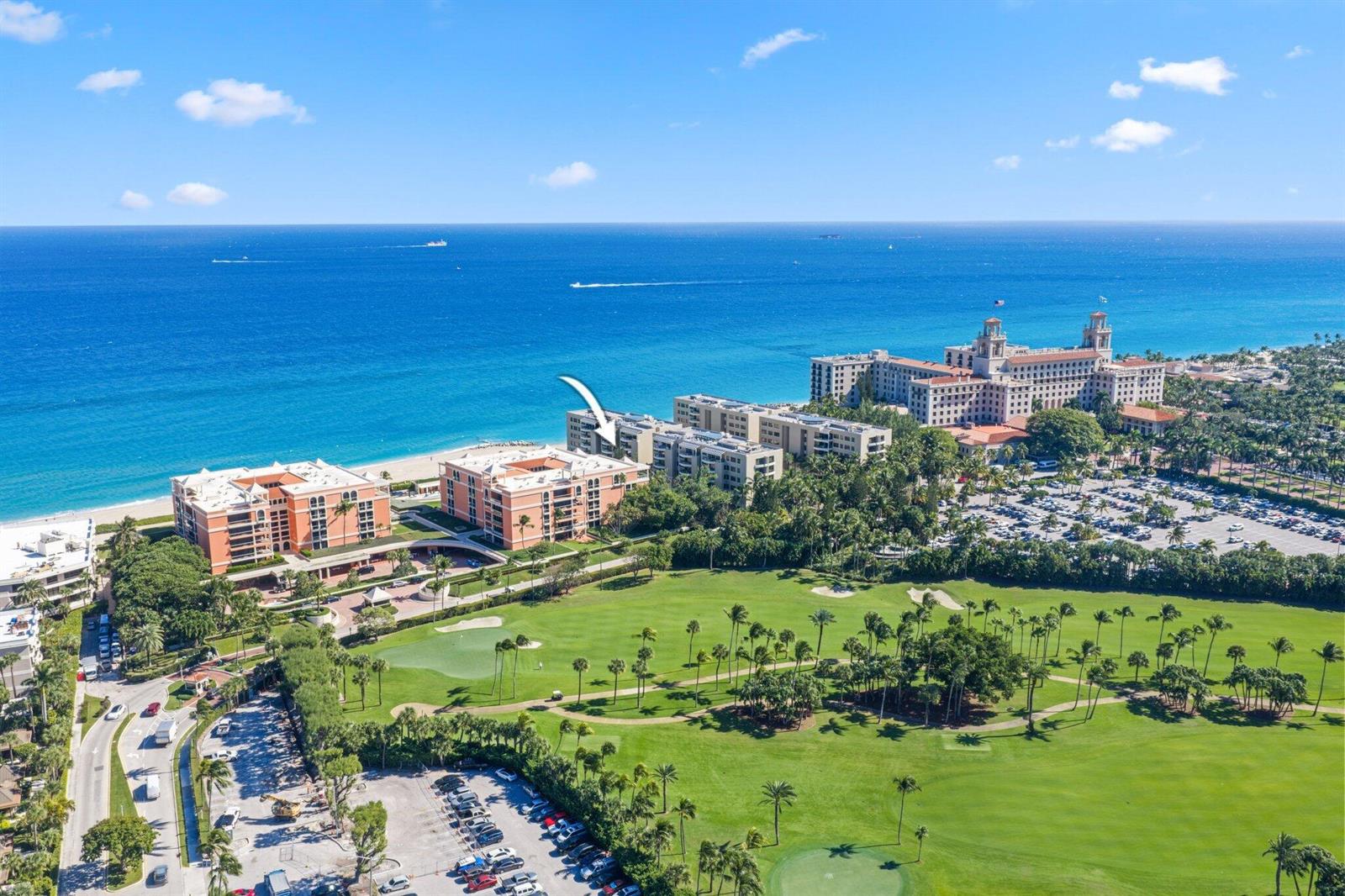 An aerial view shows beachfront condominiums, a golf course, and a large hotel complex — 2 N Breakers Row # S32, Palm Beach FL 33480, PALM BEACH, FL