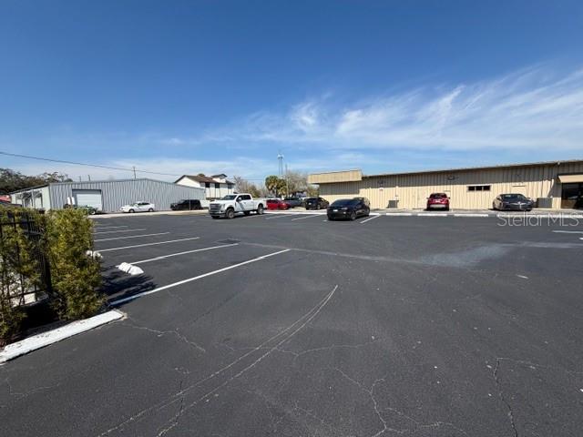 A large, paved parking lot sits in front of two commercial warehouse buildings — 663 HAROLD AVENUE, WINTER PARK, FL