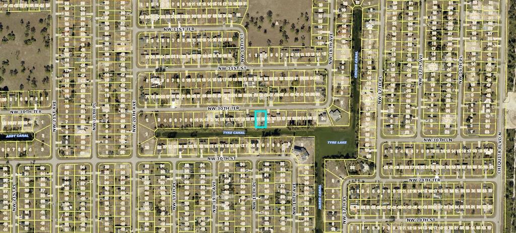 This is a satellite map showing a highlighted residential lot in a suburban neighborhood — 1824 NW 30TH TERRACE, CAPE CORAL, FL