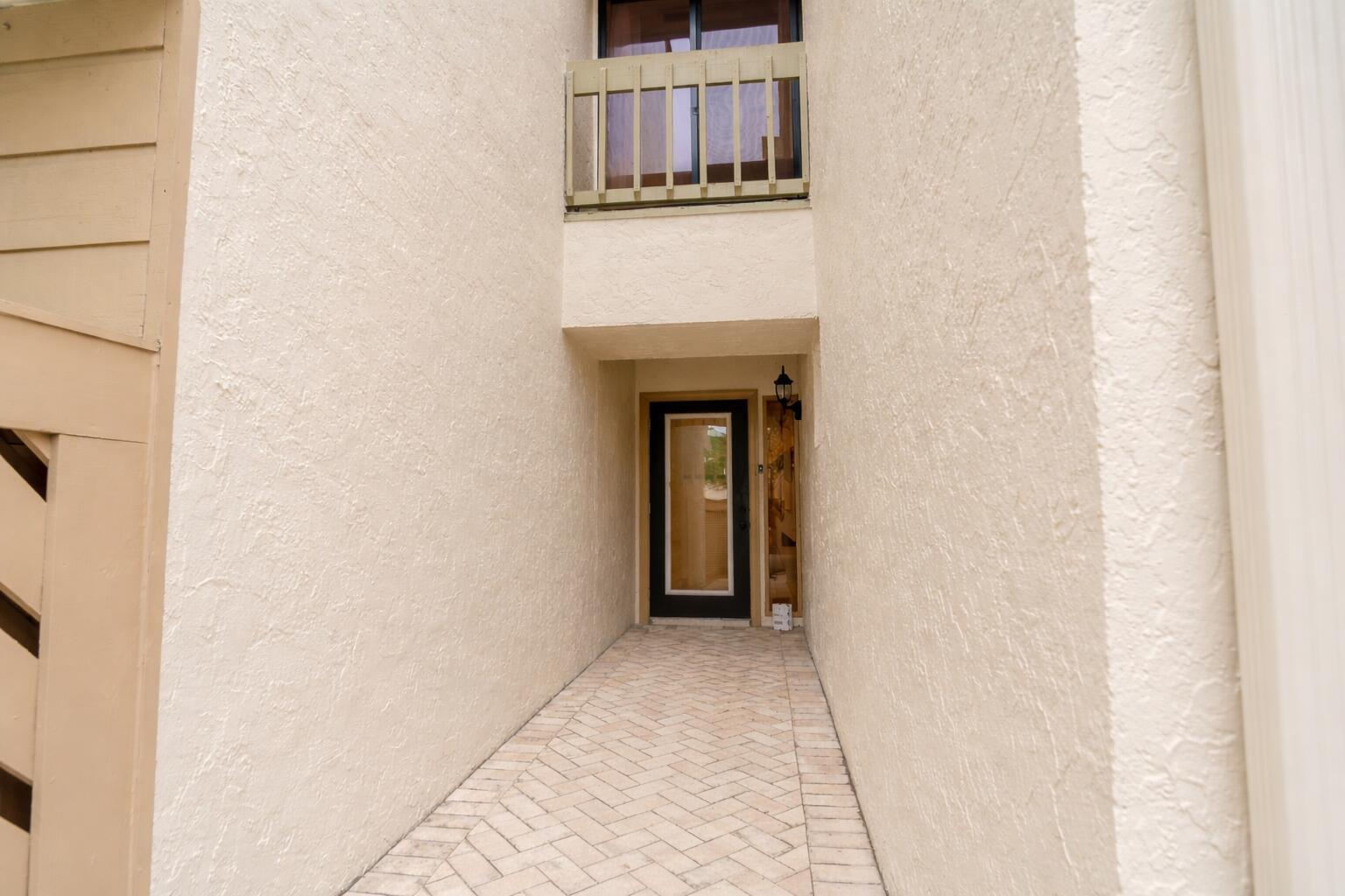 A kitchen with dark wood cabinets, granite countertops, stainless steel appliances, and tile flooring — 22954 Ironwedge Drive, Boca Raton FL 33433, BOCA RATON, FL